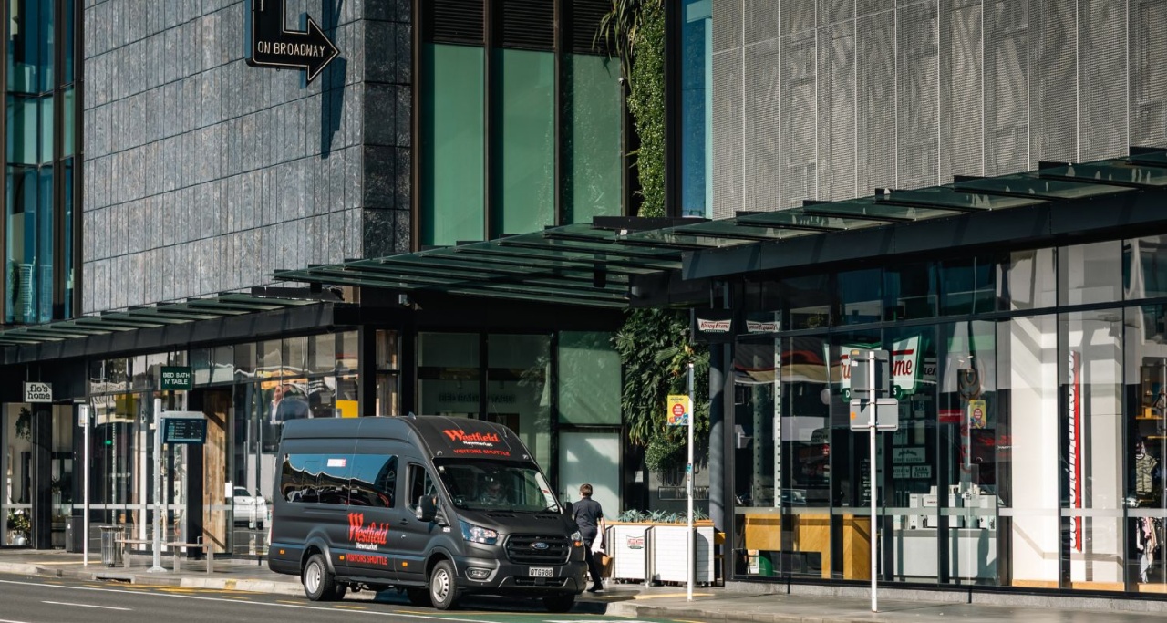 Westfield Newmarket hero banner exterior with shuttle bus parked in front