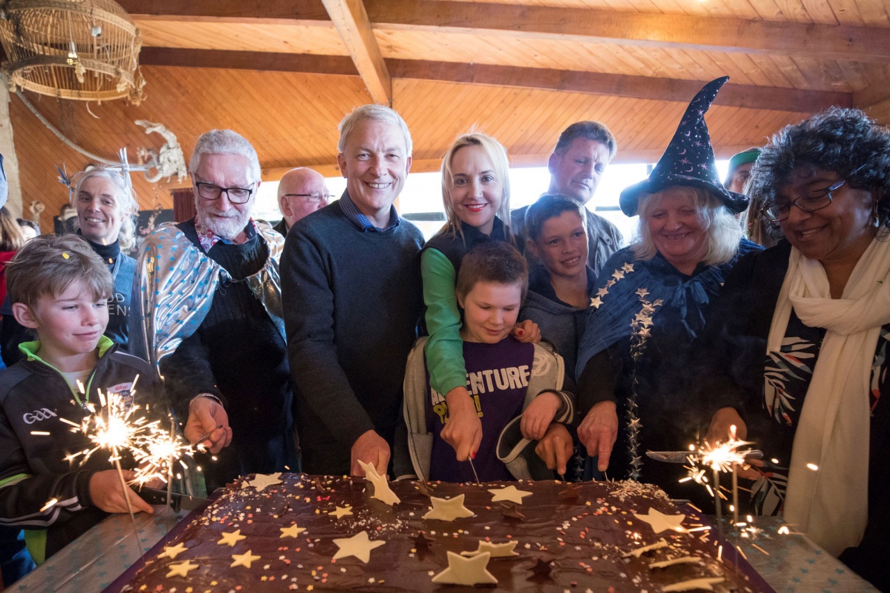 Auckland Mayor Phill Goff cuts a cake to celebrate the launch of Great Barrier Island's dark sky sanctuary