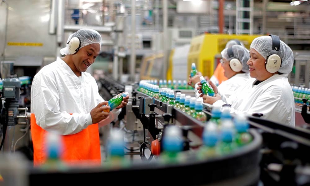 Workers on production line in a factory