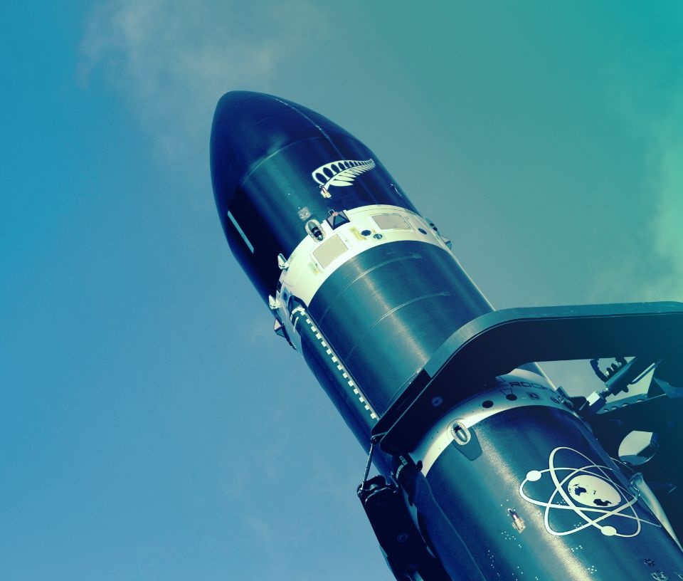Tech Auckland - Commerce - Spacetech rocket launching blue gradient