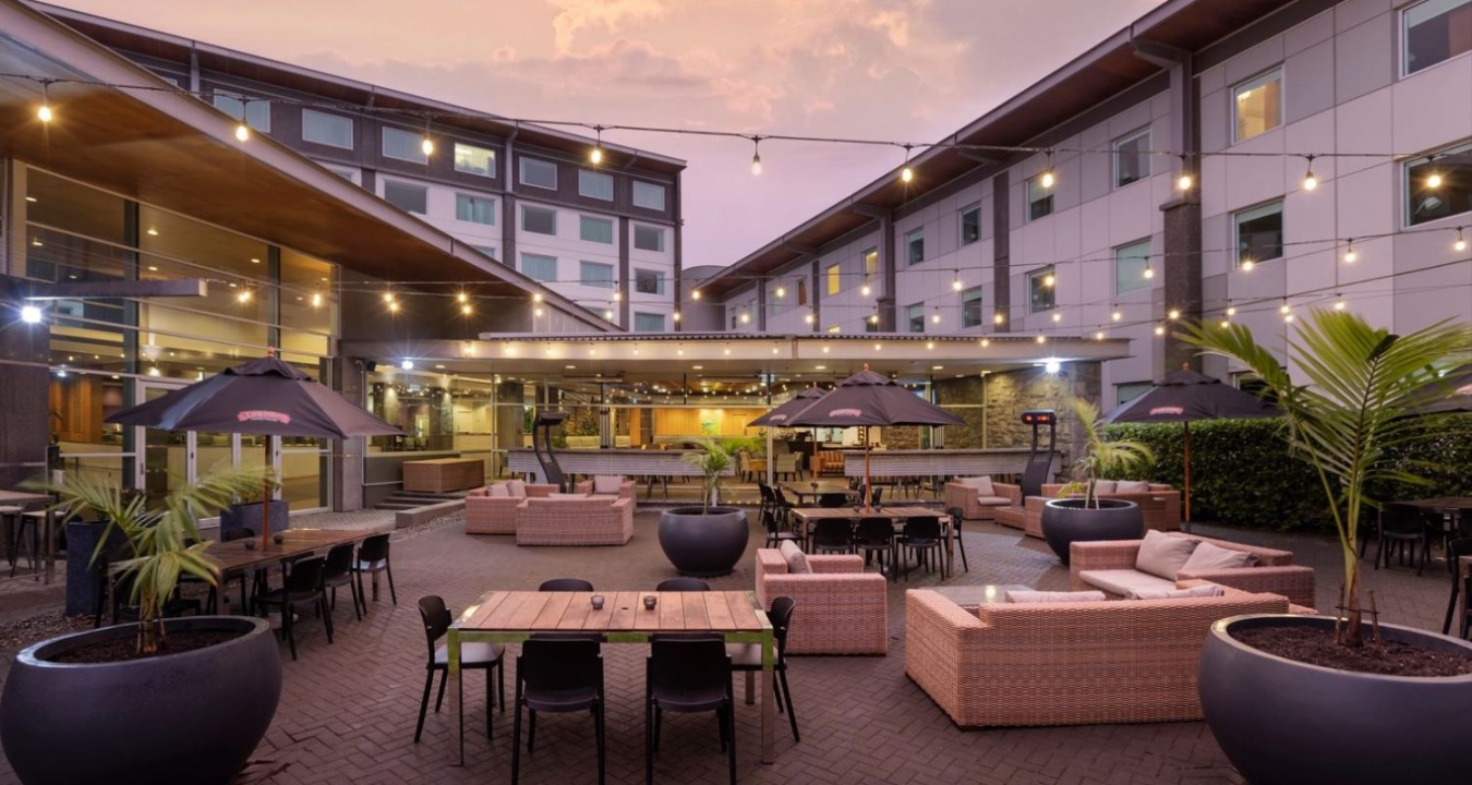 Outdoor acacia garden at Novotel Auckland Ellerslie hotel