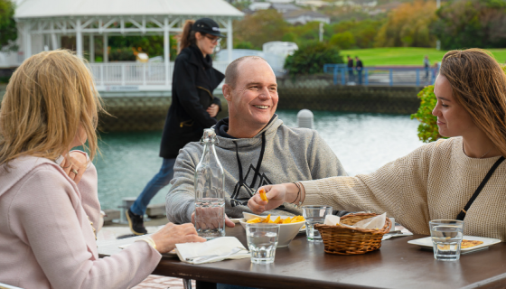 Brad and his family enjoying some food at a local cafe in Gulf Harbour