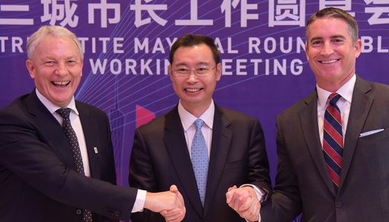 The three mayors of Auckland, Guangzhou and Los Angeles shake hands at a previous Tripartite Summit